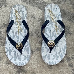 Like new navy MK flip flops